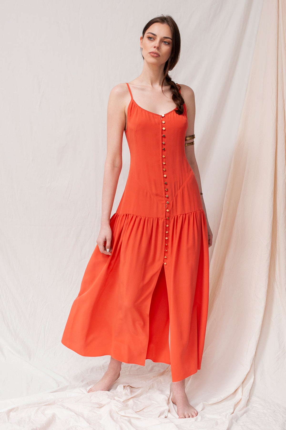 Coral maxi dress with thin straps, front buttons, and gathered skirt, sustainable handmade organic fabric.