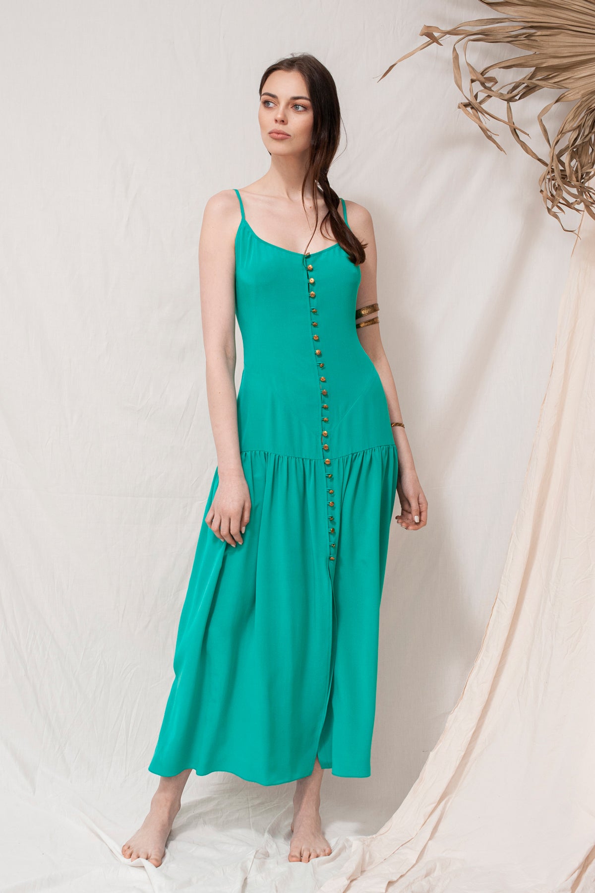 Turquoise sleeveless maxi dress with front buttons, tiered skirt, sustainable handmade organic fabric.