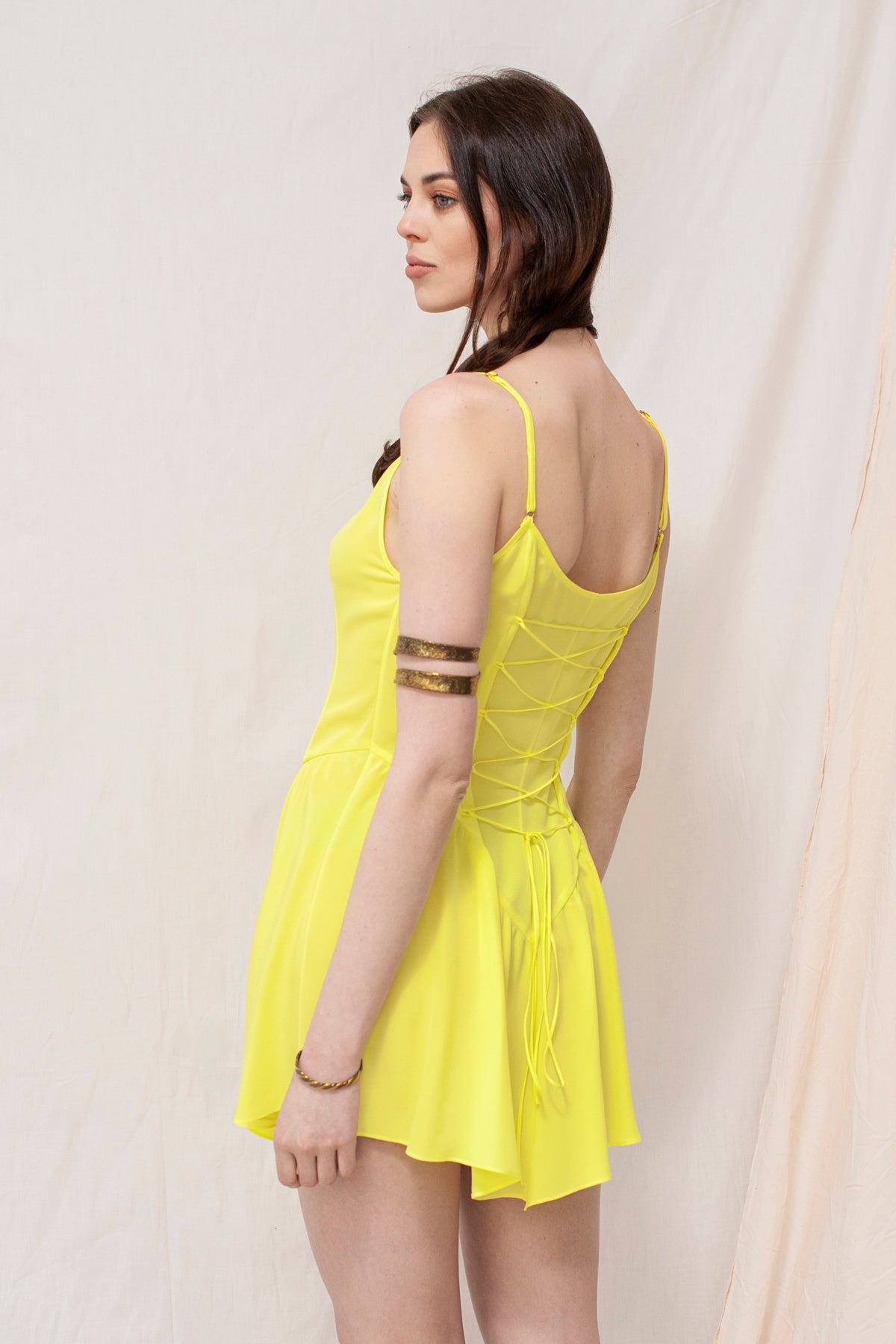 Handmade sustainable lemon yellow mini dress with spaghetti straps and ruched back, eco-friendly and organic fabric.
