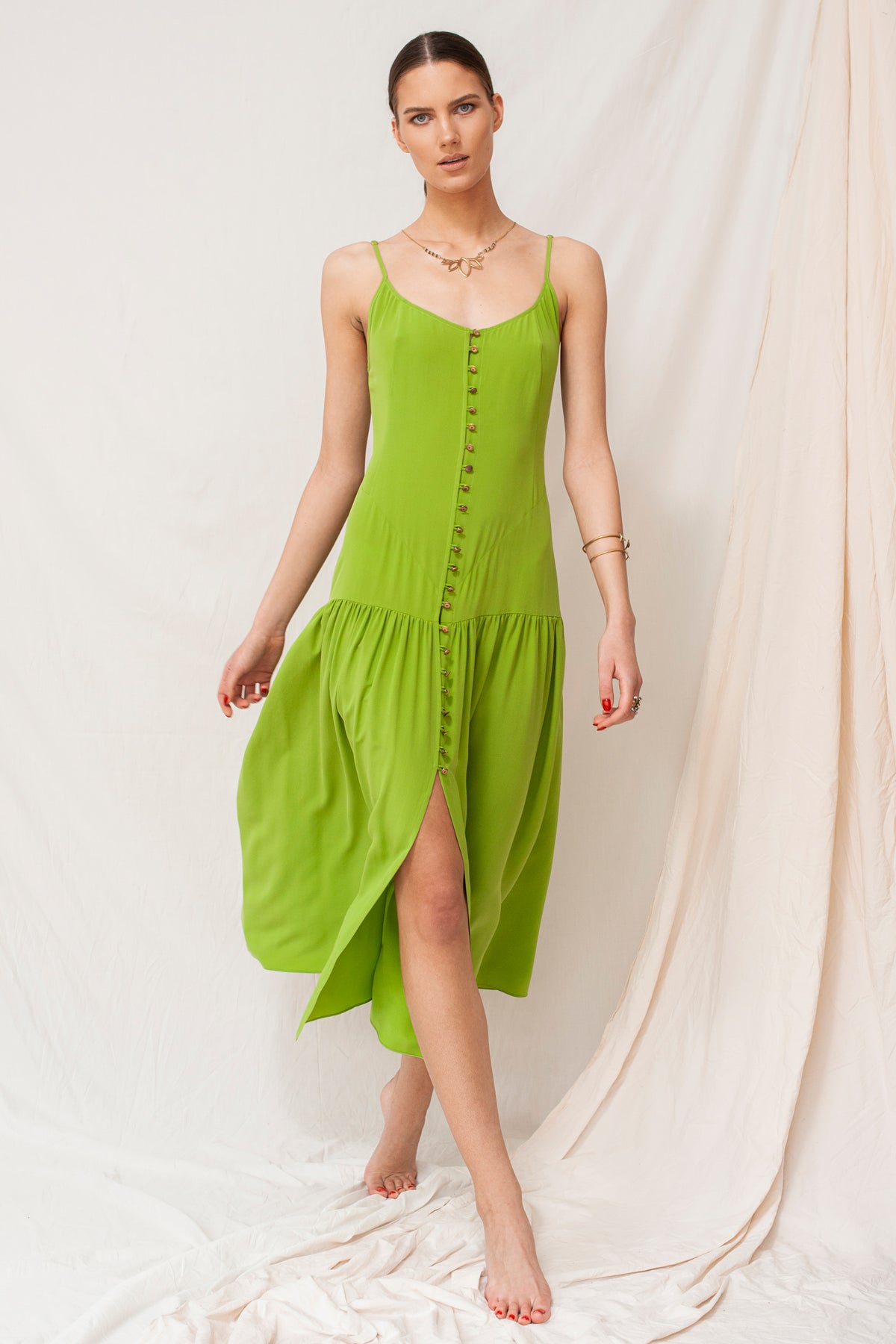 Sustainable handmade moss green maxi dress with buttons and a high slit, organic eco-friendly fabric.