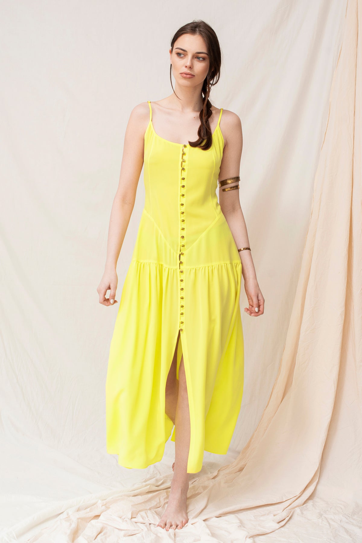 Yellow handmade organic maxi dress with buttons and adjustable straps, sustainable and eco-friendly design.