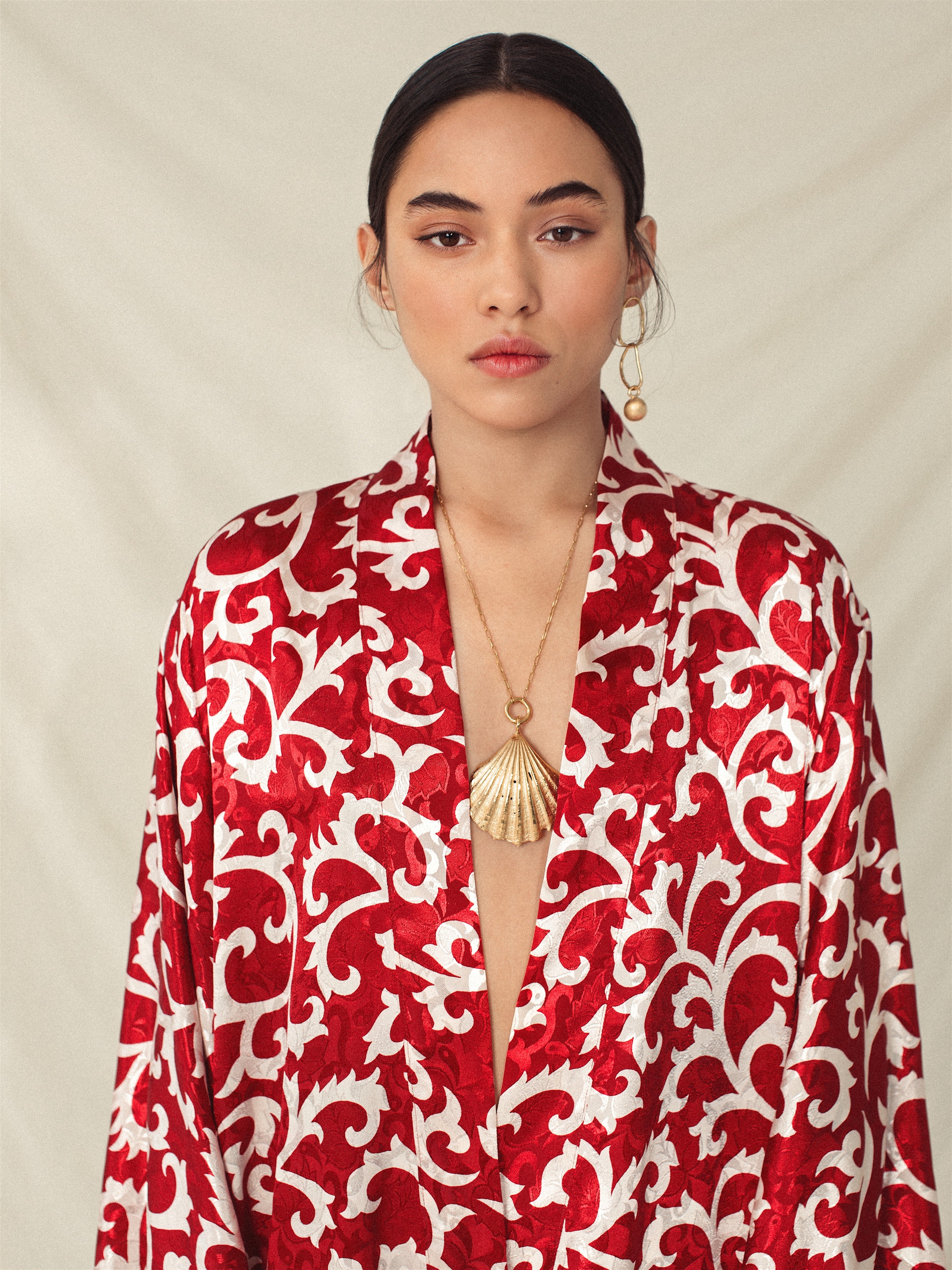 Red kimono with white organic vine pattern, sustainable handmade fabric, eco-friendly and ethical design.