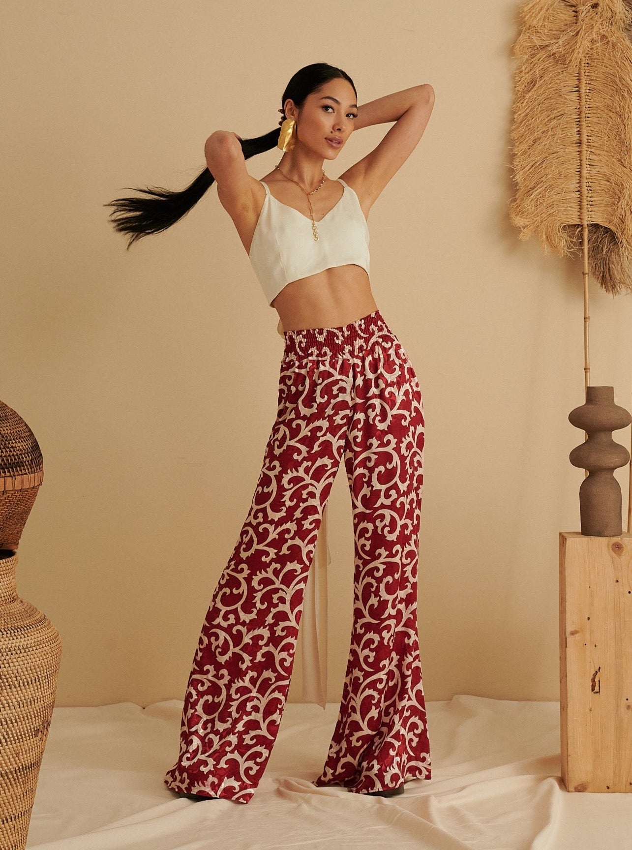 Red ruby flared trousers with white abstract print, eco-friendly and handmade organic fabric.