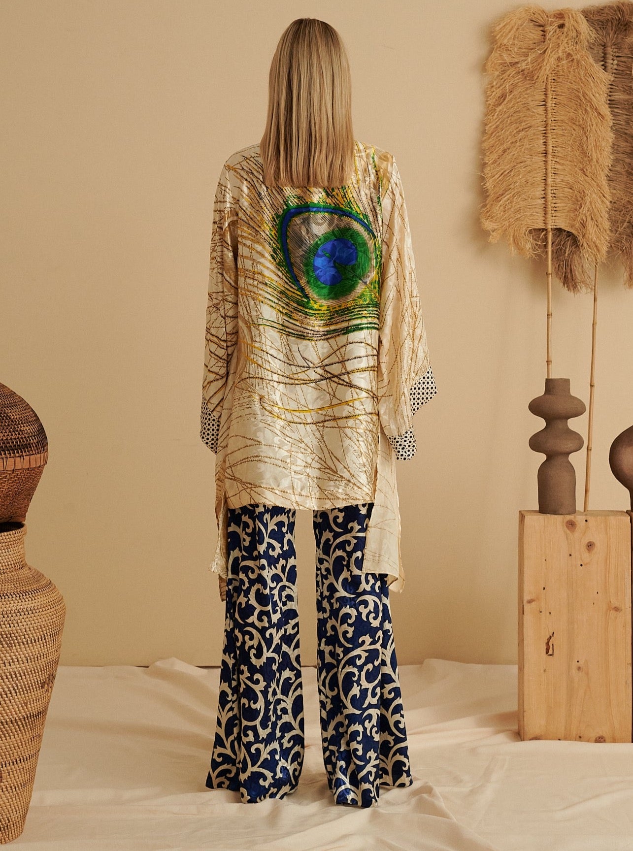 Handmade sustainable kimono with peacock design in blue sapphire, paired with organic patterned pants.