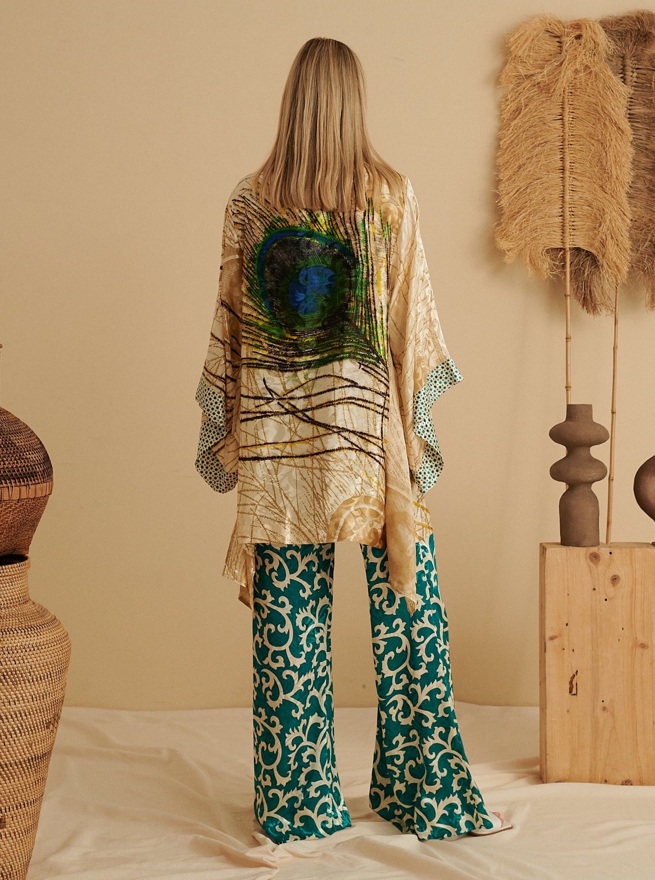 Handmade sustainable kimono in emerald green with peacock feather design, eco-friendly fabric.