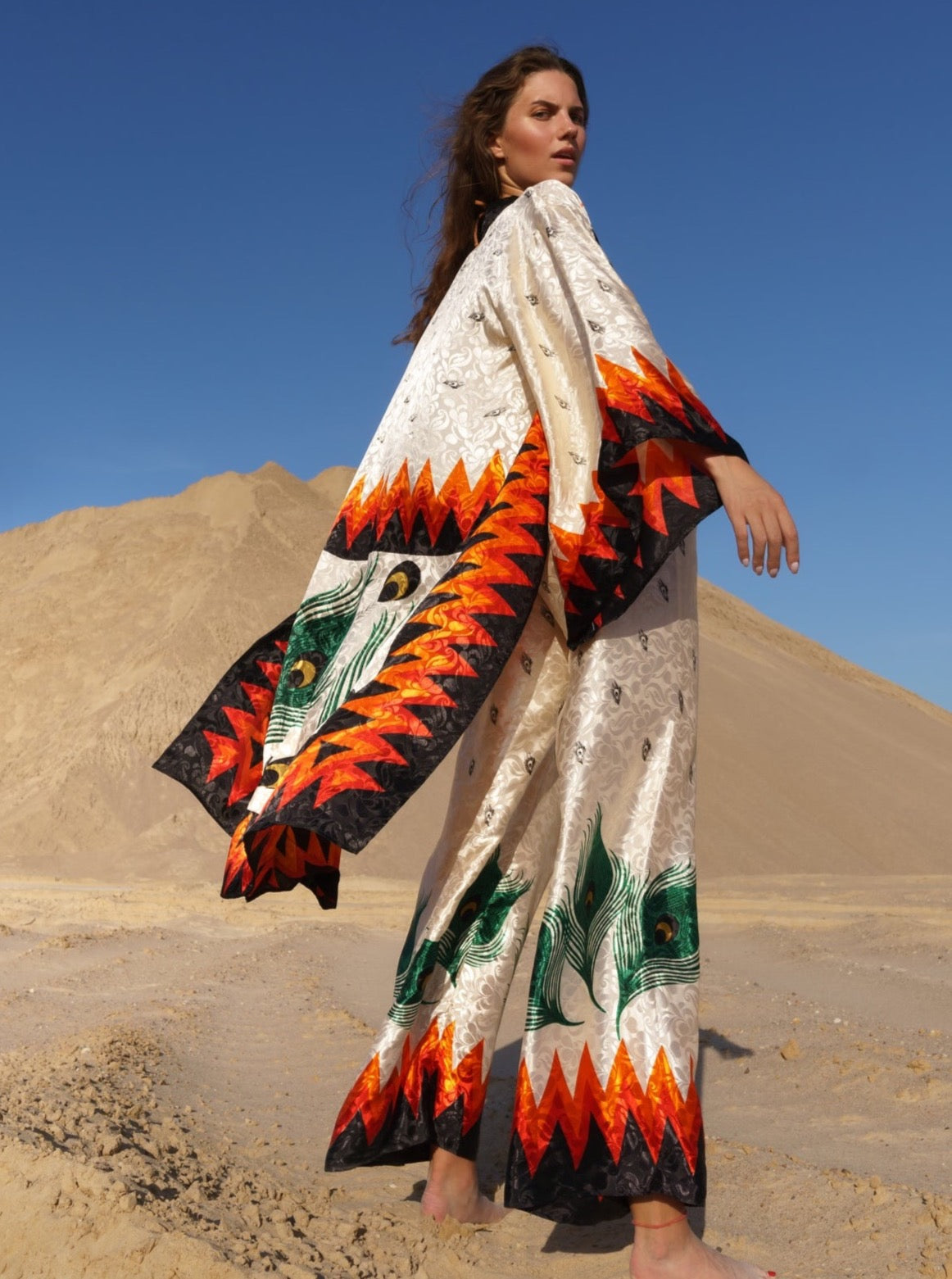 Black onyx kimono with bold flame patterns in orange and green, sustainable, handmade, eco-friendly organic fabric.