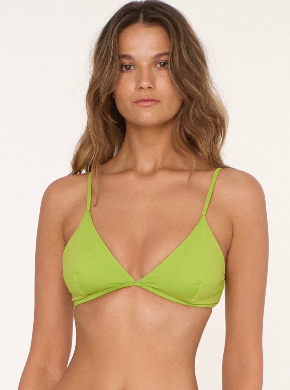 Sustainable handmade frog green organic crop top with thin straps and a deep V neckline.